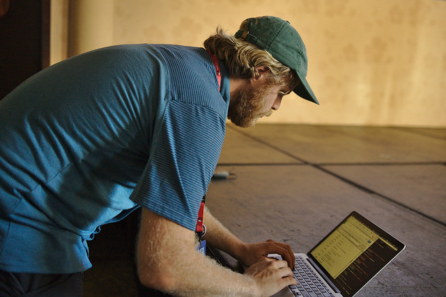 Eric Holscher using a laptop